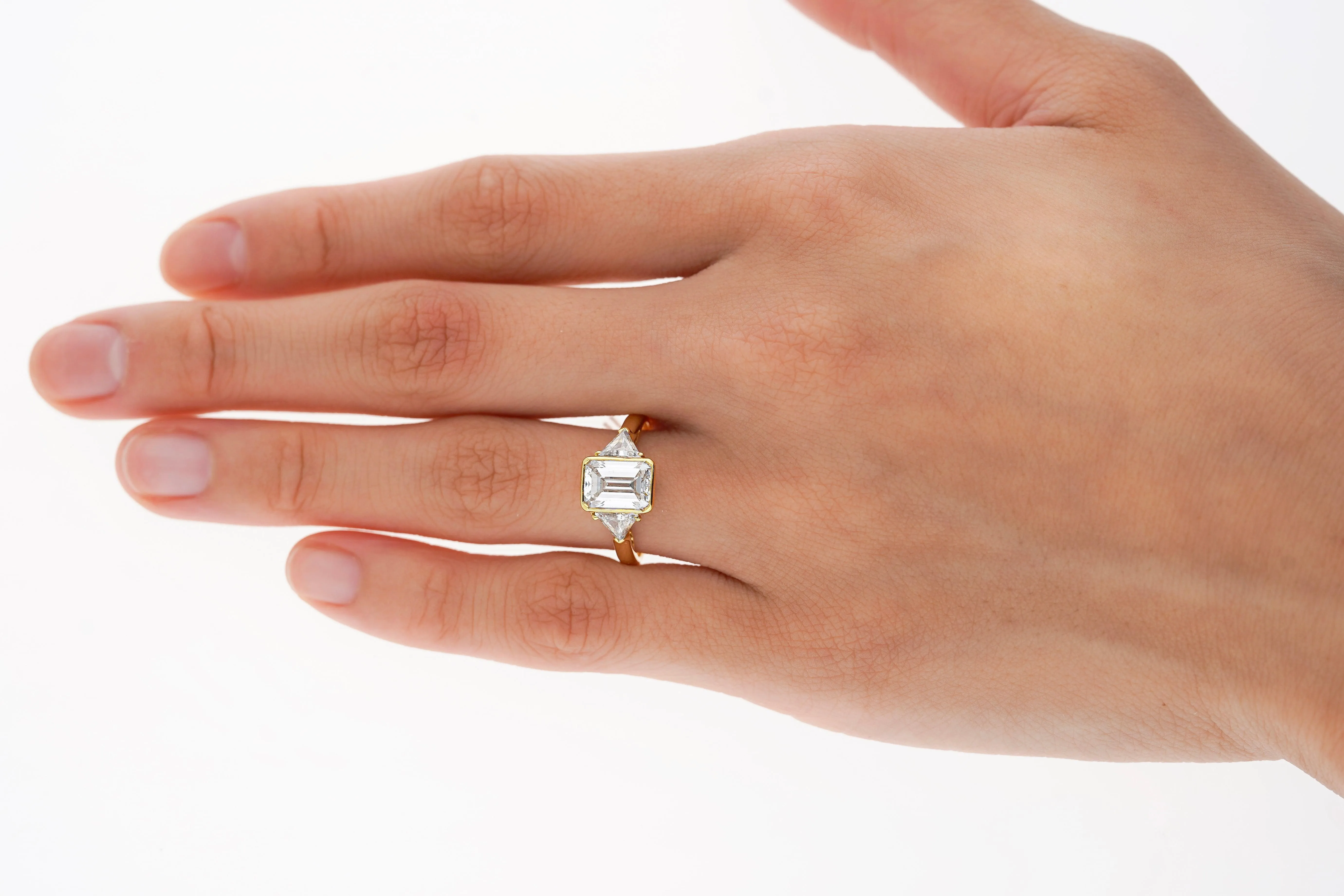 Boucheron Signed Ring With Bezel Set GIA Certified 2.09 Carat Emerald Cut E/SI1 Diamond and Trillion Side Stones